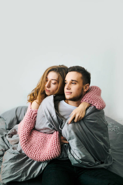 Young couple hugging at home. Artwork. Soft focus - Foto, immagini