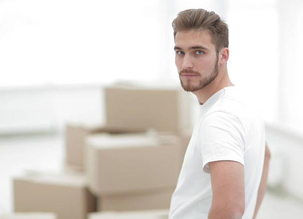 confident man standing in a new apartment - Photo, image
