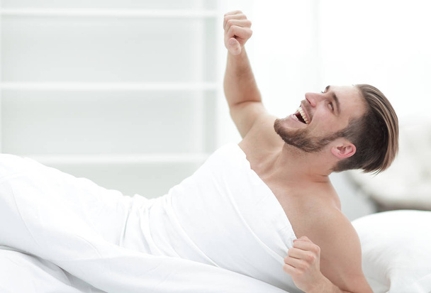 smiling man waking up in the morning - Foto, Imagen