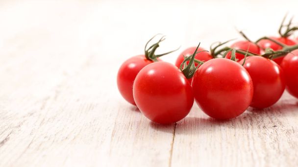 fresh red cherry tomatoes on wooden table - Fotoğraf, Görsel