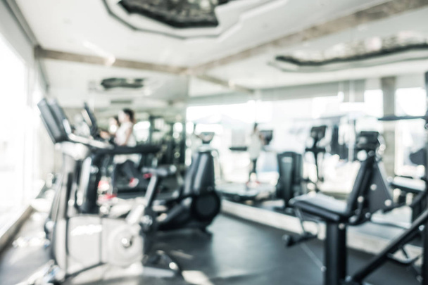 Abstract blur defocused fitness equipment and gym interior for background - Foto, imagen