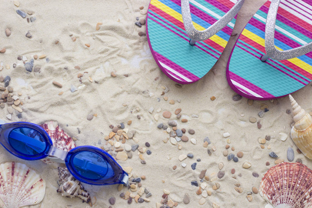 Vacation accessories on sand background - Фото, зображення