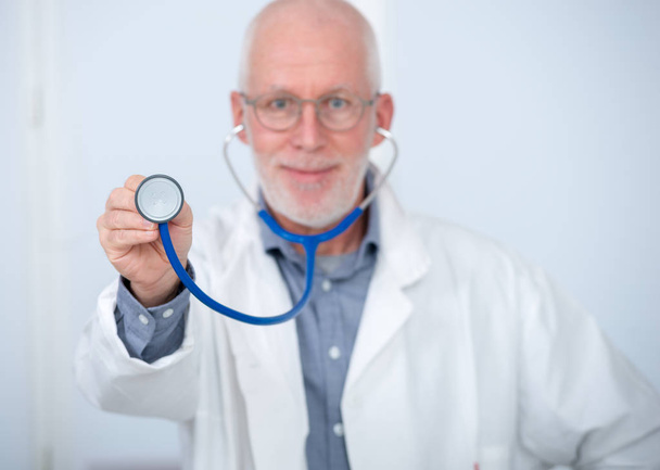 portrait of medical doctor with stethoscope - 写真・画像