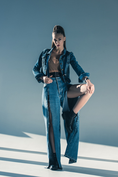 beautiful young woman posing in denim clothes - 写真・画像