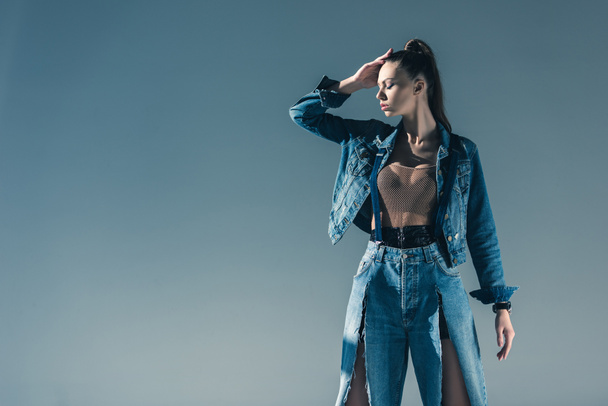beautiful stylish girl in denim clothes, isolated on grey - Foto, afbeelding