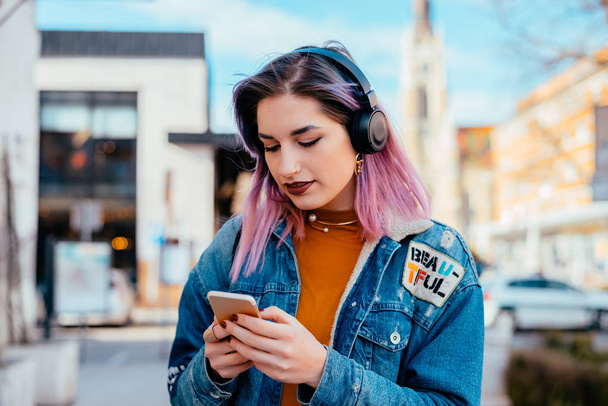  girl using phone and listening music - Photo, image