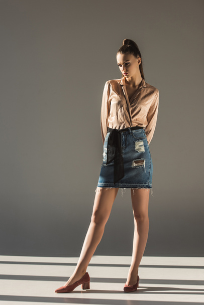 beautiful stylish girl posing in blouse and denim skirt - Fotoğraf, Görsel