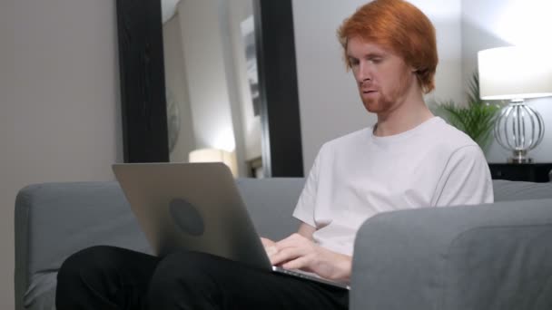 Redhead Man Sad for Failure, Working on Laptop - Felvétel, videó