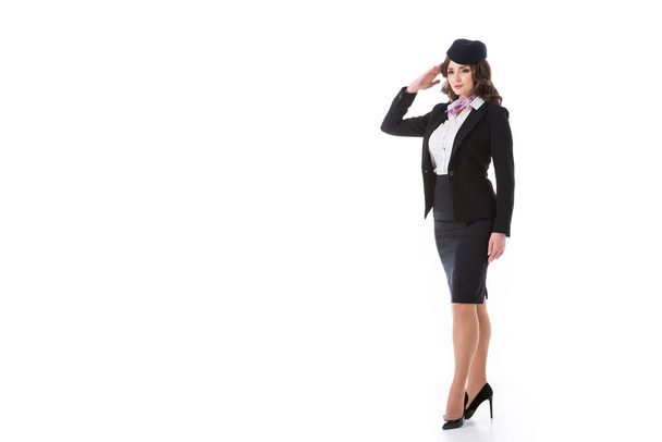 beautiful stewardess saluting isolated on white - Photo, Image