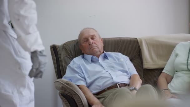 Funny astronaut behaving badly, stealing medication from residents in nursing home. - Metraje, vídeo