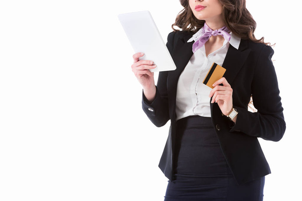 cropped image of stewardess with tablet and credit card isolated on white - Fotoğraf, Görsel