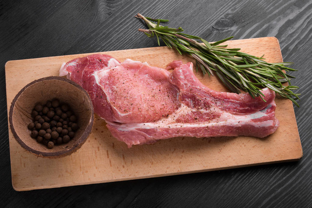 raw pork meat with rosemary - Photo, Image