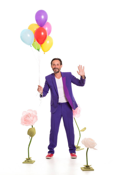 Nice man with balloons and flowers - Фото, изображение