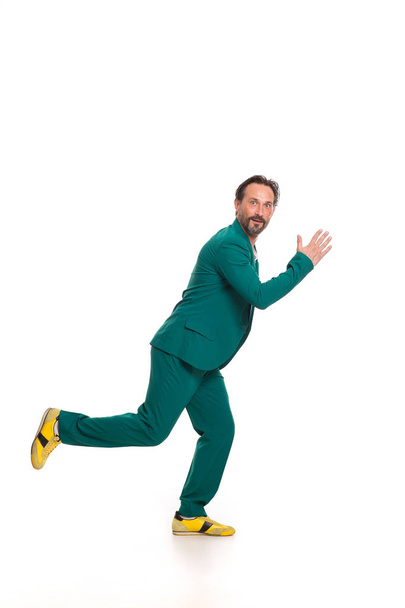 Handsome man in green suit - Фото, изображение