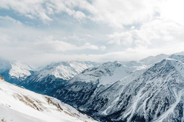 Snow-capped peaks of the Caucasus Mountains. Caucasian landscape - 写真・画像