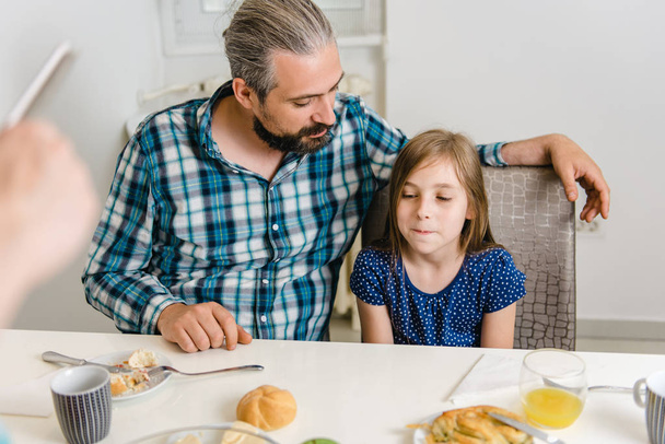 Father and Daughter having conversation during breakfast - Photo, image