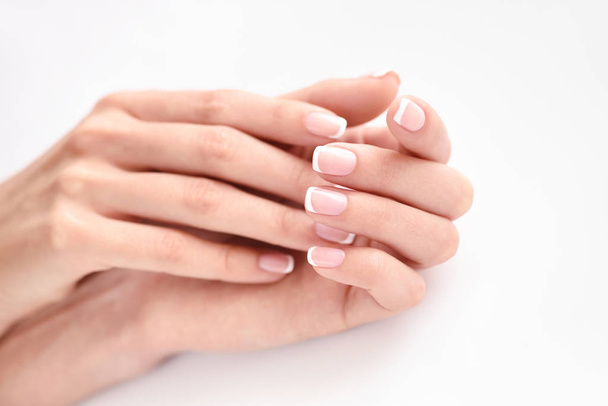 Beautiful woman hands with french manicure - Foto, Imagen