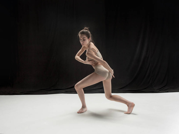 Young teen dancer on white floor background. - Foto, Imagem