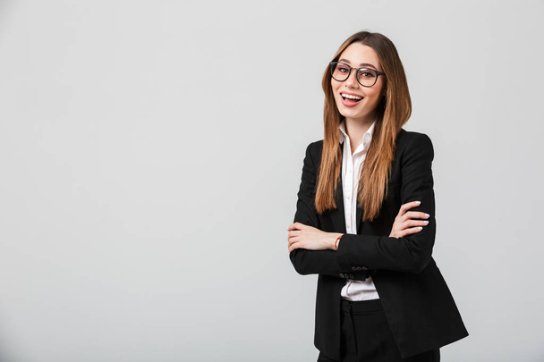 Portrait of a happy businesswoman dressed in suit - Photo, image