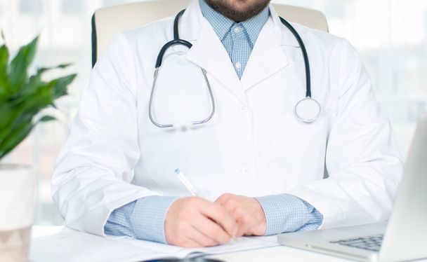 Healthcare and medical concept. Doctor writing prescription - Photo, Image