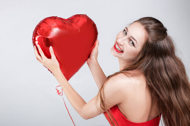 woman with heart shaped air balloons. - Fotó, kép
