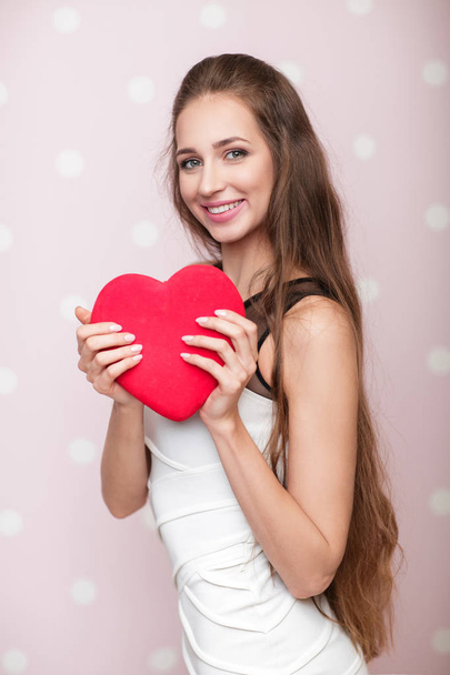 woman holding red heart - 写真・画像