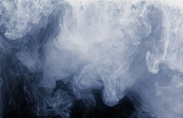Abstract of white smoke pattern on a black background. - Photo, image