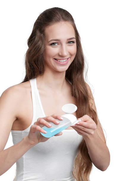 woman hold cotton pad and tonic - Photo, image