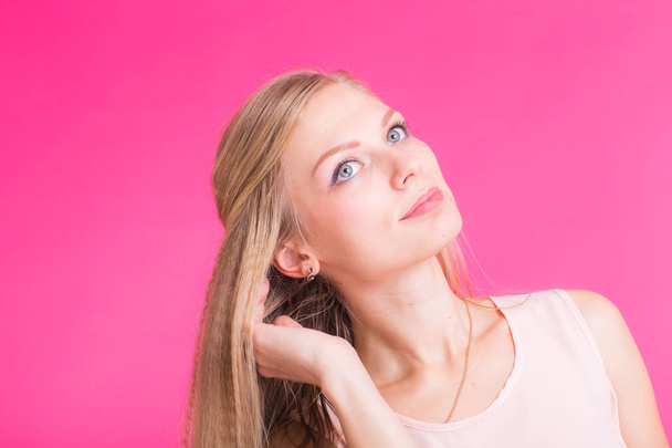 Fashion blonde over pink background. Woman portrait. - Fotoğraf, Görsel