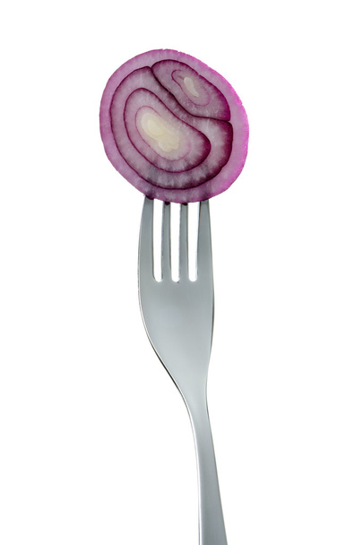Red onion rings on a fork against white background - Photo, Image