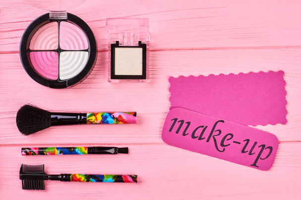 Pink shiny eyeshadows on colorful background. - Photo, Image