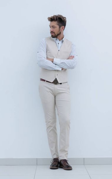 Full length portrait of stylish man with crossed hands - Fotó, kép