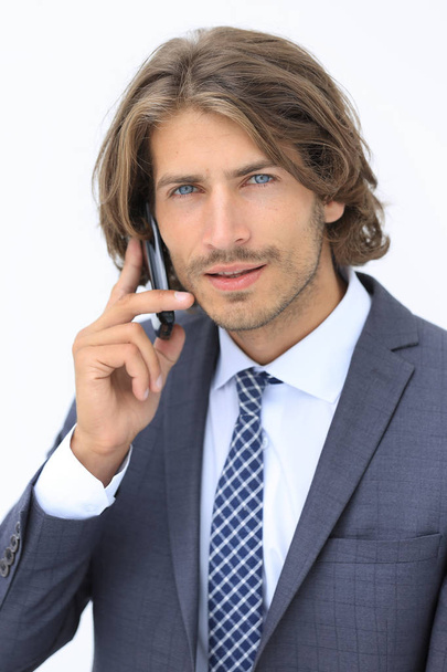 young man listening on a phone on a white background - Photo, image