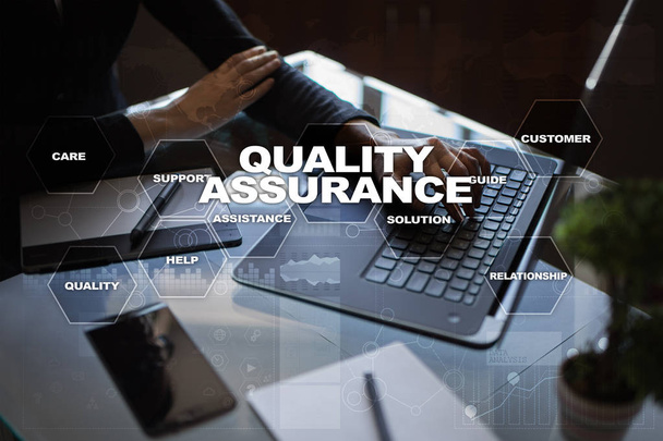 Quality assurance concept on the virtual screen. Business concept. - Zdjęcie, obraz