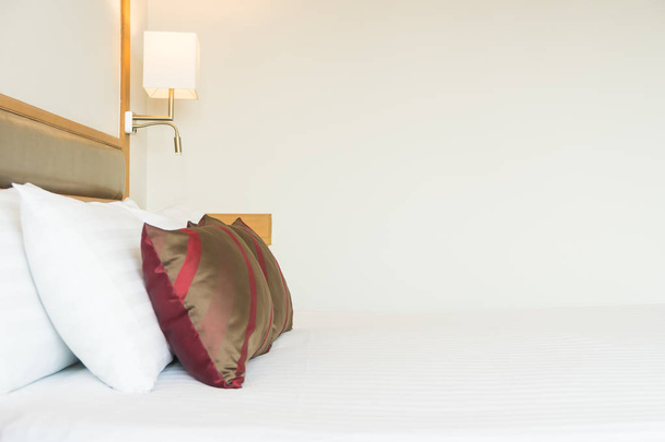 Comfortable pillow on bed decoration in bedroom interior - Фото, изображение