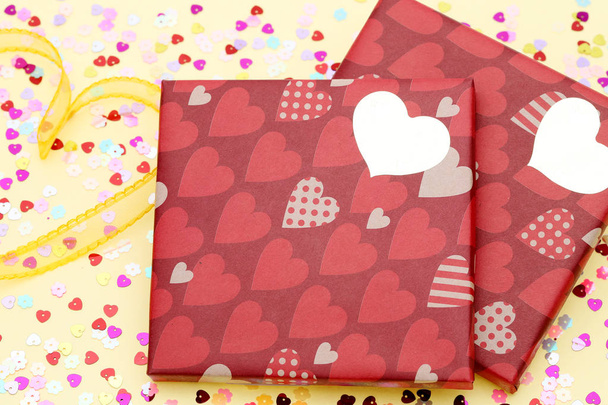 Valentine's Day concept. Gift with bow on the yellow background - Photo, Image