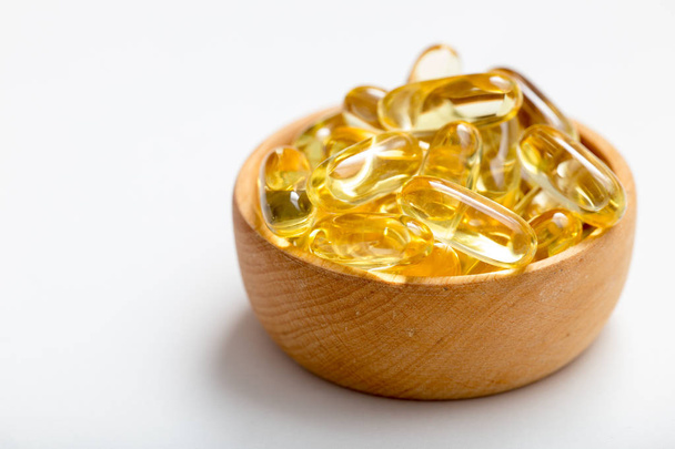 Fish oil capsules with omega 3 and vitamin D. healthy diet conce - Photo, Image
