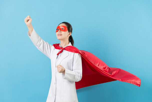 pretty female clinic doctor dress up as superhero - 写真・画像