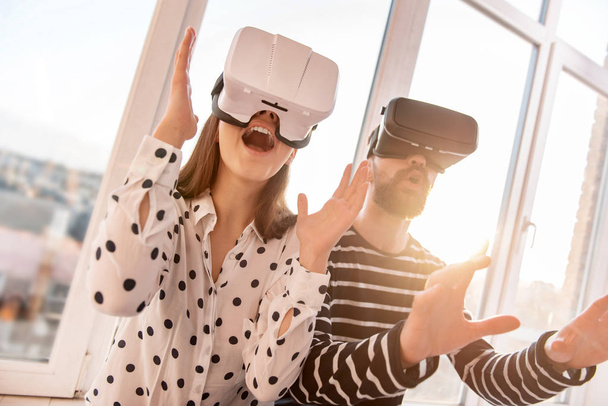 Sincere vigorous couple transferring to VR world - Foto, immagini