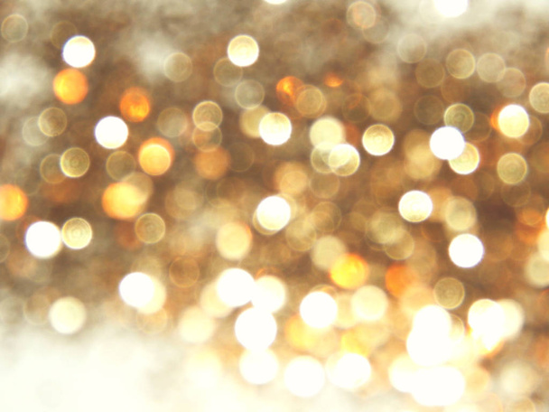 Gyönyörű homályos arany háttér, ünnepi bokeh fény - Fotó, kép