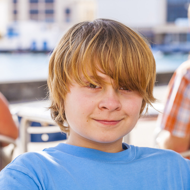 Outdoor portrait of relaxed cute young boy - Photo, Image