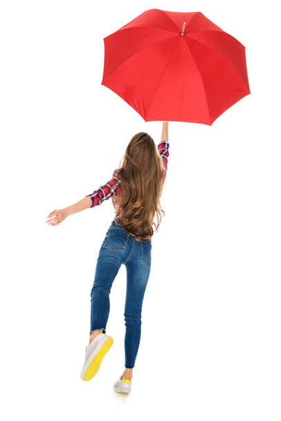 back view of girl holding red umbrella isolated on white - Foto, Imagem
