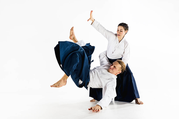 Man and woman fighting at Aikido training in martial arts school - Fotografie, Obrázek