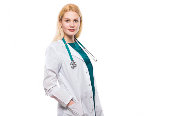 Young confident doctor with hands in pockets looking at camera - Photo, Image