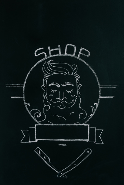 close up view of drawn emblem of bearded man on blackboard - Foto, Imagem