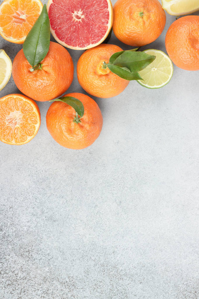 Fresh fruits. Citrus background. Mandarin, grapefruit, lime, tangerine, lemon. Top view, copy space - Fotó, kép