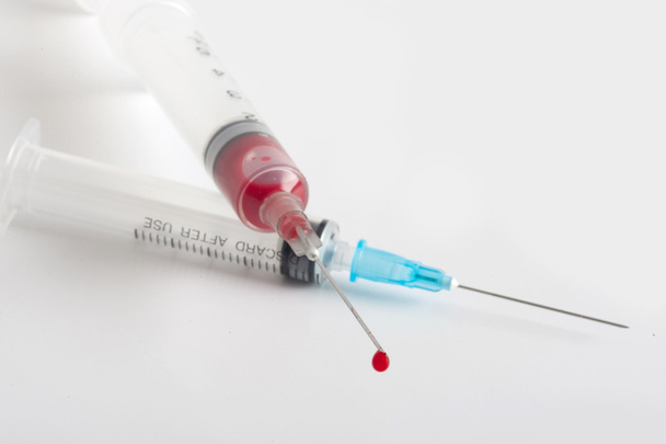 Syringe with blood - Photo, image