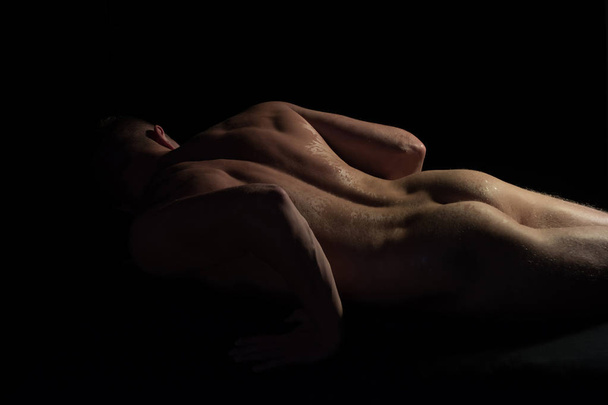 muscular body of macho man, athlete isolated on black. - Photo, Image