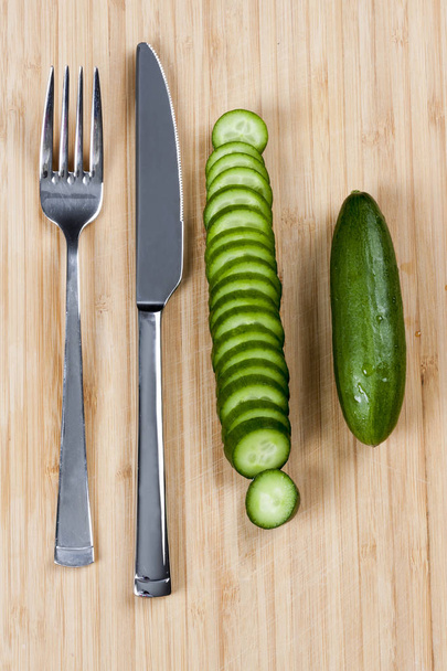 Green cucumbers on chopping board - Photo, Image
