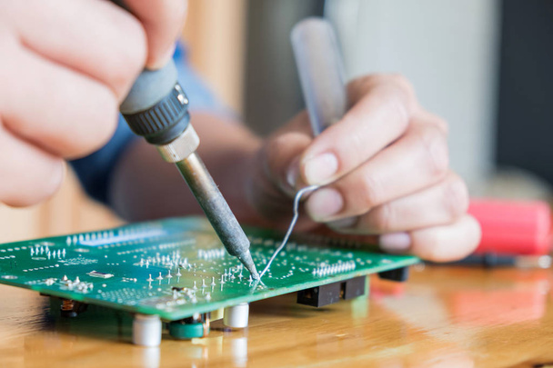 Technician repair circuit board,Use soldering equipment on circu - 写真・画像